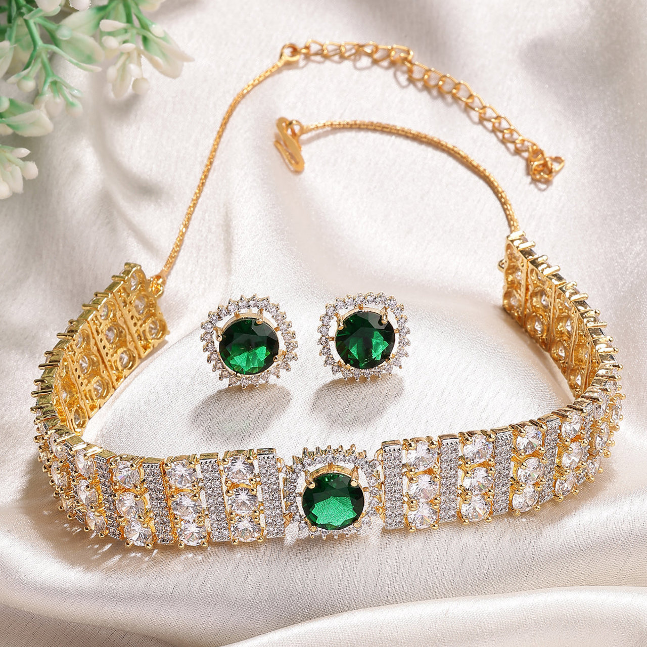 Sukkhi Eye Catchy Gold Plated Cubic Zirconia Studded Emerald Green Brass Choker Necklace with Studs Earrings Jewellery Set for Women
