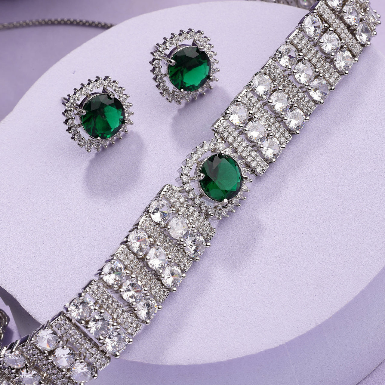 Sukkhi Delicate Fashionable Design Rhodium Plated Cubic Zirconia Studded Emerald Green Brass Choker Necklace with Studs Earrings Jewellery Set for Women