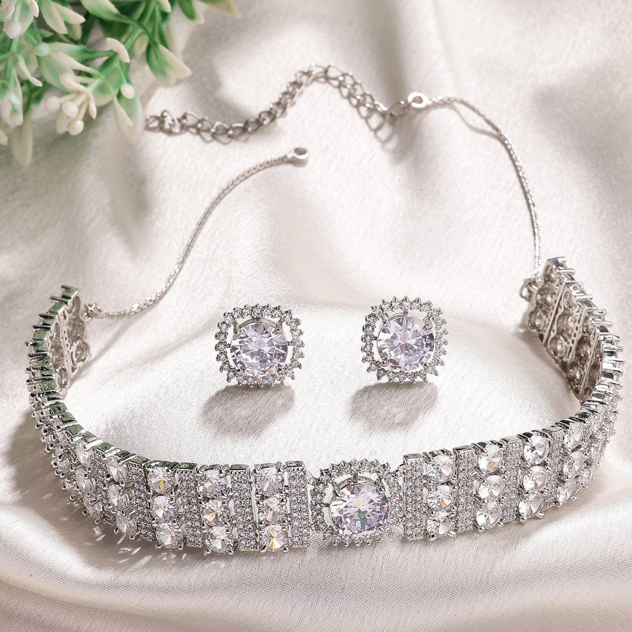 Sukkhi Decent Stylish Design Rhodium Plated Cubic Zirconia Studded White Brass Choker Necklace with Studs Earrings Jewellery Set for Women