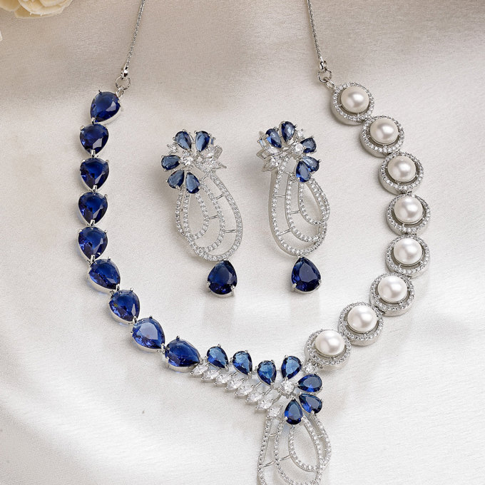 Sukkhi Classic Tear Drop Round Design Rhodium Plated Cubic Zirconia & Pearl Studded Blue Brass Collar Necklace & Drop Earrings Jewellery Set for Women