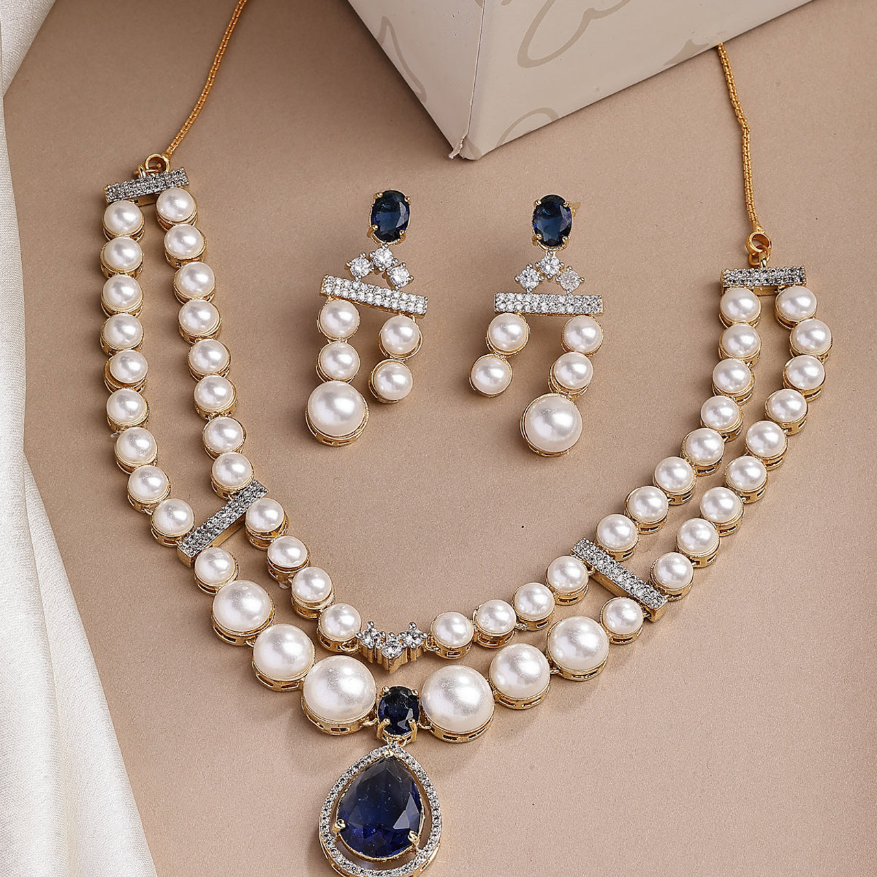 Sukkhi Glamorous Blue Pear Design Gold Plated CZ & Pearl Studded Brass Two Layered Collar Necklace with Drop Earrings Jewellery Set for Women