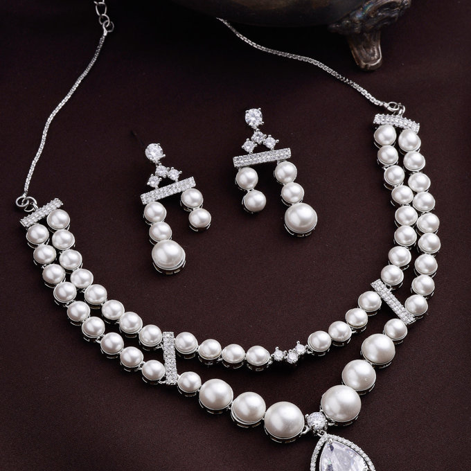 Sukkhi Classic Pear Design Rhodium Plated with CZ & Pearl Studded Brass White Two Layered Collar Necklace with Drop Earrings Jewellery Set for Women