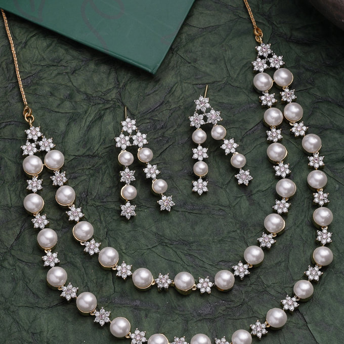 Sukkhi Creative Floral Design Gold Plated with CZ & Pearl Studded White Brass Two Layered Collar Necklace with Drop Earrings Jewellery Set for Women