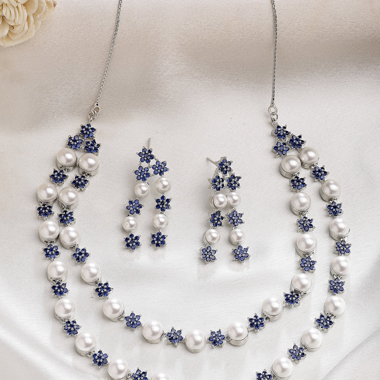 Sukkhi Desirable Blue Floral Design Rhodium Plated with CZ & Pearl Studded Brass Two Layered Collar Necklace with Drop Earrings Jewellery Set for Women