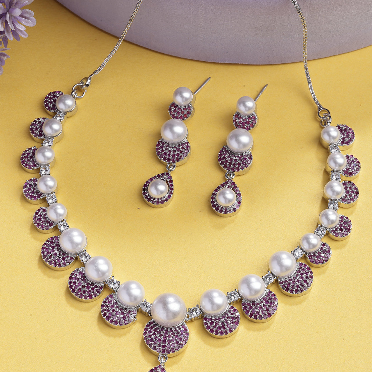 Sukkhi Flawless Round Design Rhodium Plated with Cubic Zirconia & Pearl Studded Red Brass Collar Necklace with Drop Earrings Jewellery Set for Women
