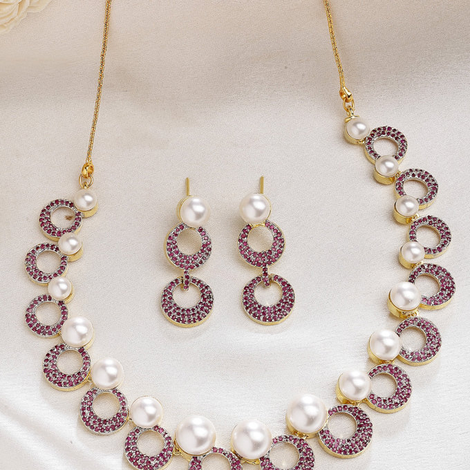 Sukkhi Bewitching Round Design Gold Plated with Cubic Zirconia & Pearl Studded Red Brass Collar Necklace with Drop Earrings Jewellery Set for Women