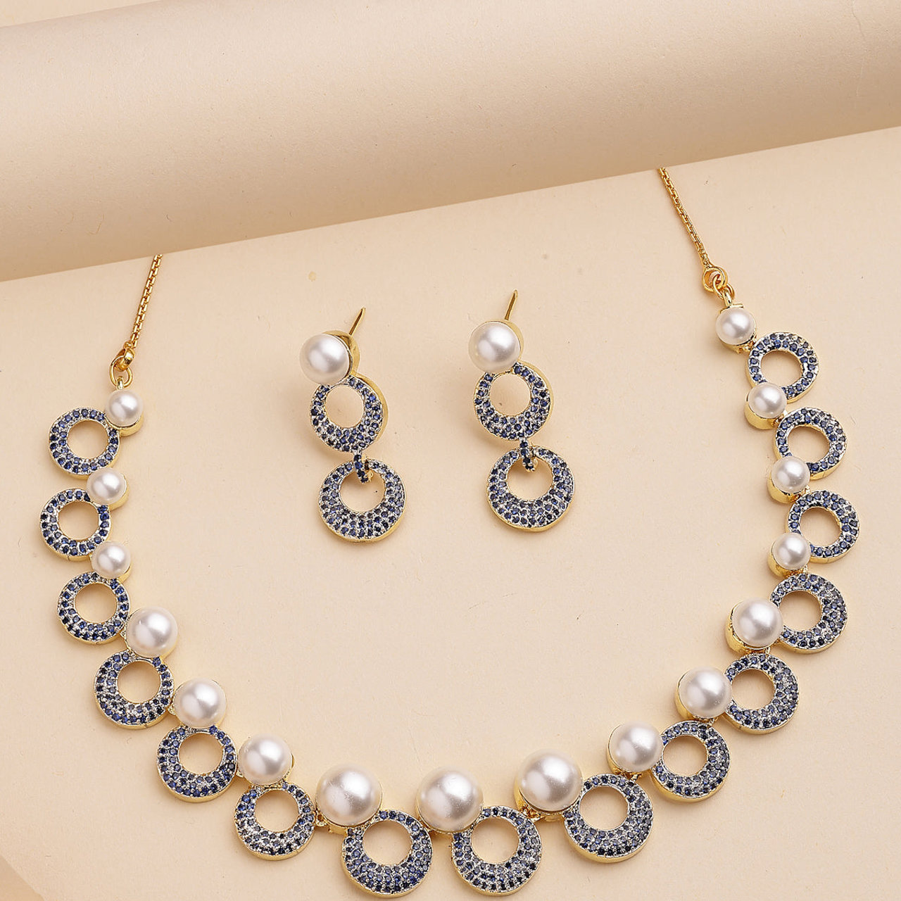 Sukkhi Modern Round Design Gold Plated with Cubic Zirconia & Pearl Studded Blue Brass Collar Necklace with Drop Earrings Jewellery Set for Women
