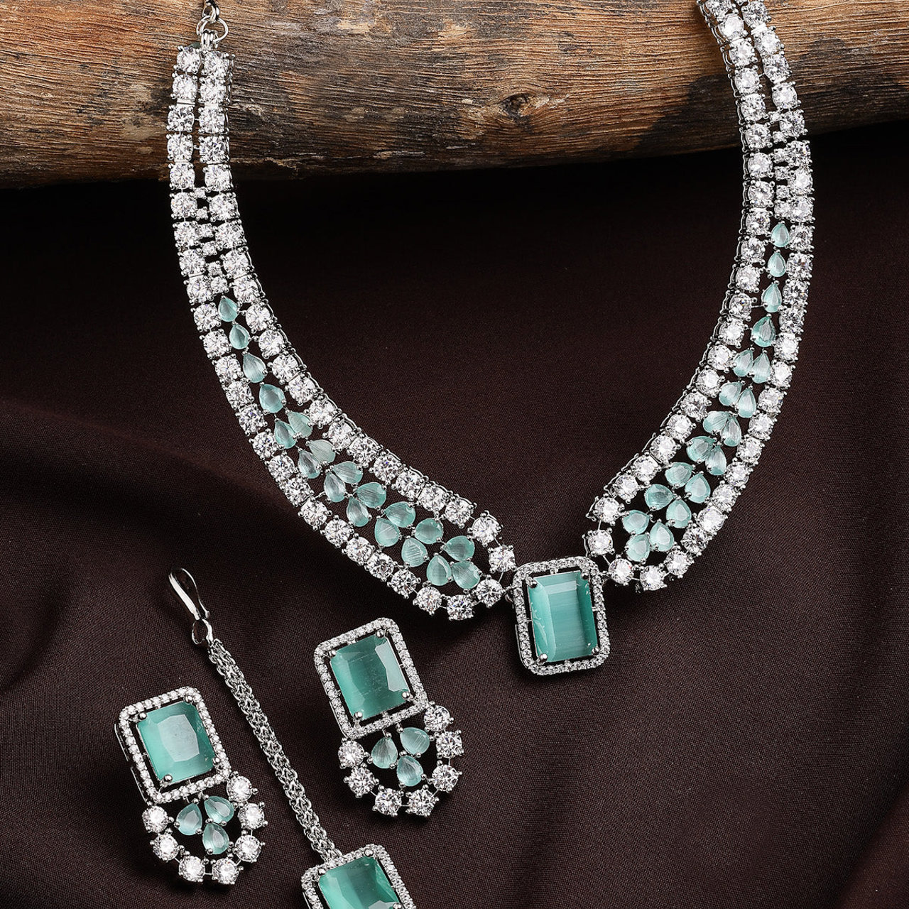 Sukkhi Elegant Style Rhodium Plated Cubic Zirconia Studded Mint Green Brass Collar Necklace with Studs Earring & Maangtikka Jewellery Set for Women